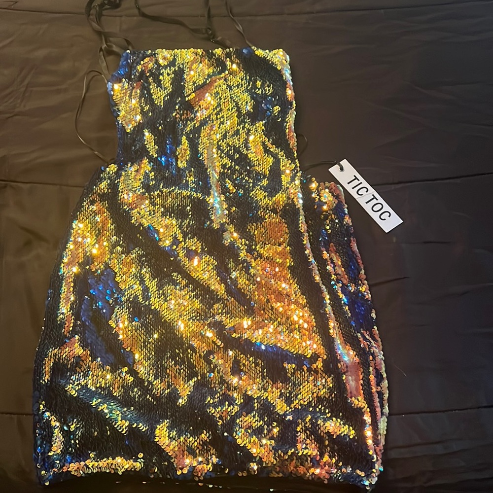 This is a sequin backless dress,  hugs your curves and great for parties